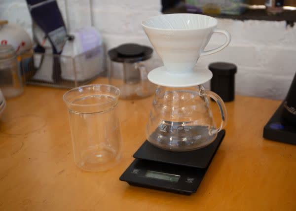 Photograph of pour-over coffee brewing at a cafe bar