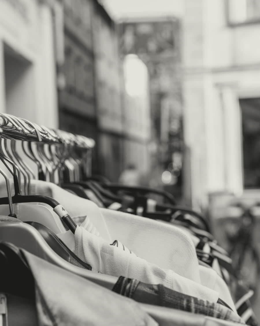 Shirts on a shop rail, black-and-white photograph